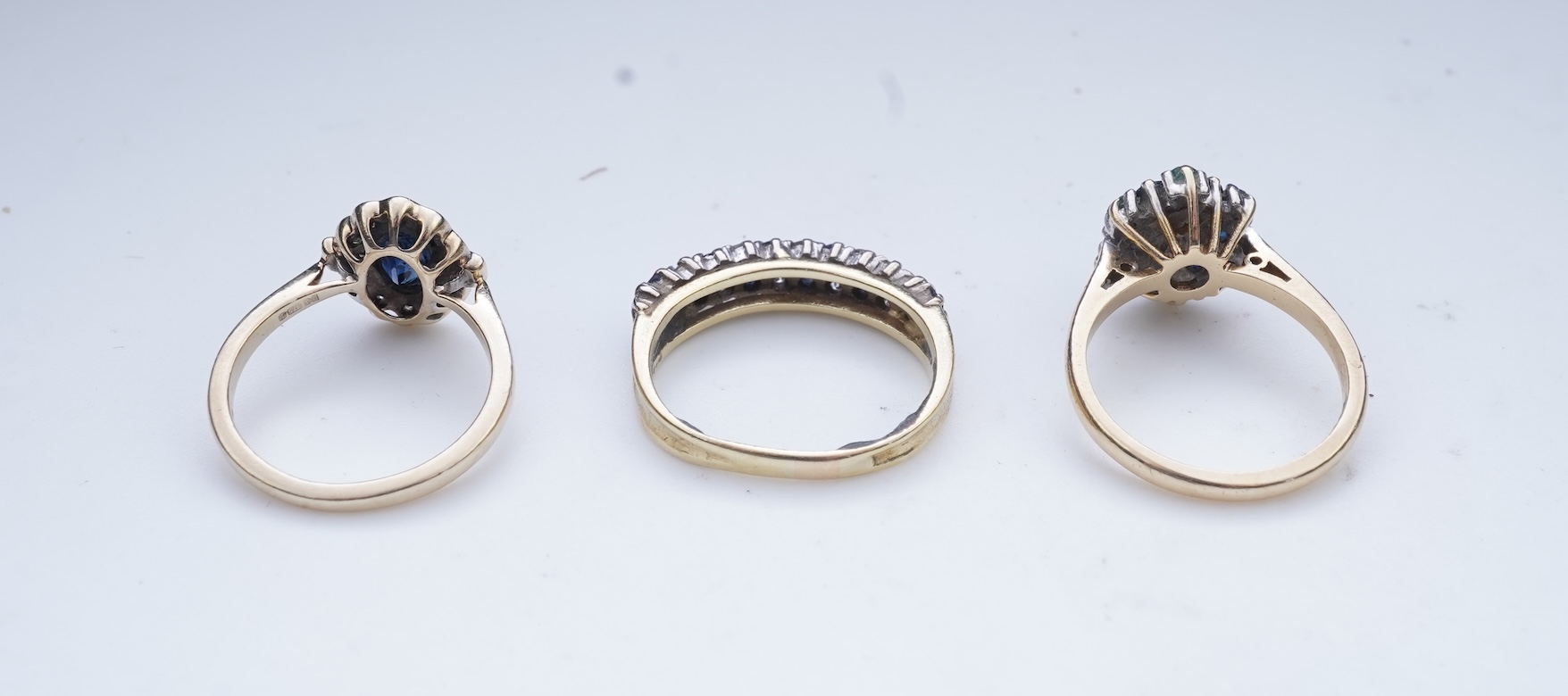 A collection of three sapphire and diamond rings
